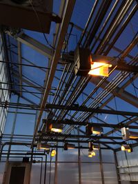 Low angle view of illuminated lamp against sky