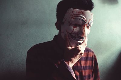 Close-up of a man with human hand