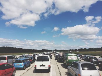 Cars on road against sky