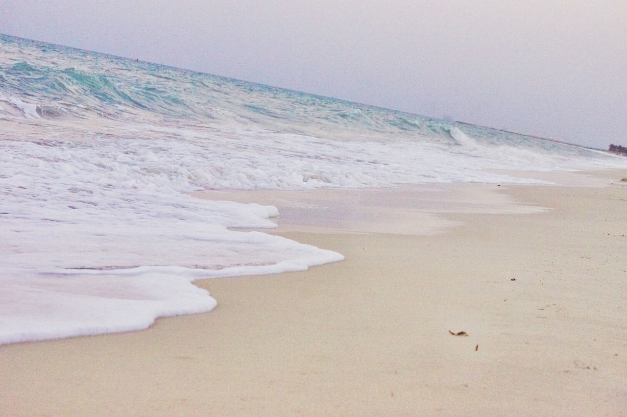 sand, beach, shore, sea, tranquility, tranquil scene, horizon over water, scenics, footprint, beauty in nature, nature, clear sky, water, wave, surf, sand dune, remote, idyllic, coastline, vacations