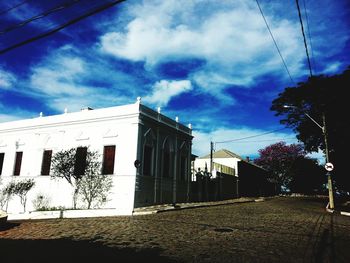 Low angle view of buildings against blue sky