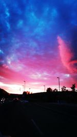 Road against cloudy sky at sunset