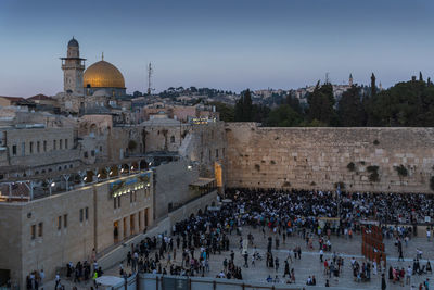 Group of people in temple against buildings