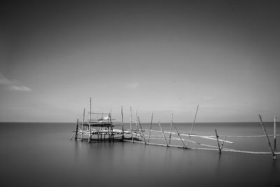 Sailboat in sea against sky