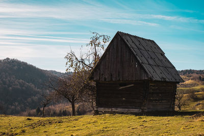 Romanian old chalet in the fall season, fantanele village, sibiu county, cindrel mountains, romania