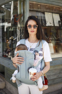 Portrait of young woman drinking coffee