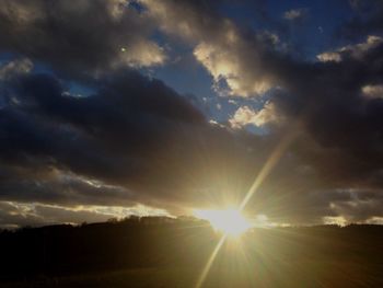 Scenic view of landscape against cloudy sky