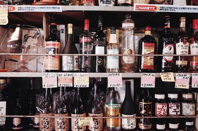 Full frame shot of bottles on display at market stall