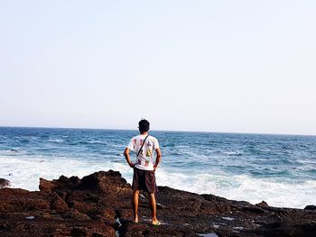 Man looking at sea against sky