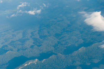 Aerial view of clouds over mountain