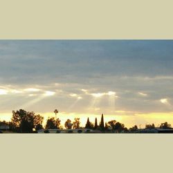 Scenic view of landscape against sky at sunset