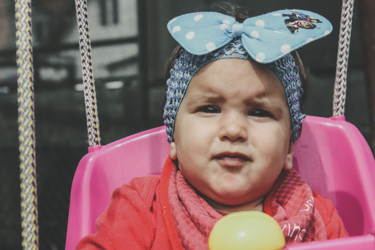 child, childhood, one person, innocence, portrait, real people, front view, cute, headshot, baby, young, close-up, babyhood, girls, focus on foreground, looking away, looking, pink color, warm clothing