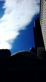 Low angle view of building against blue sky