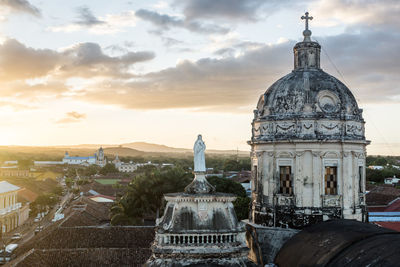 Historic building against sky at sunset