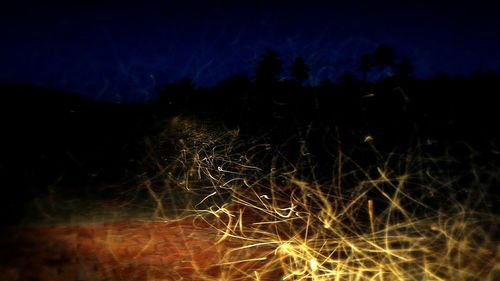 Scenic view of landscape against sky at night