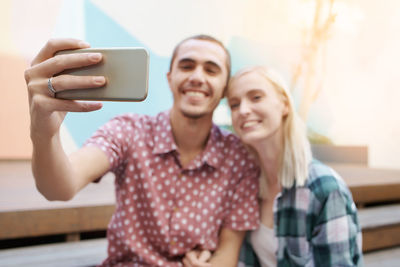 Couple taking selfie outdoors