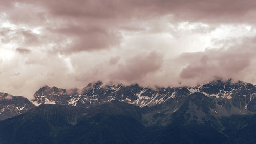 Panoramic shot of snowcapped mountains against sky