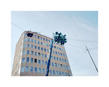 Low angle view of office building against sky