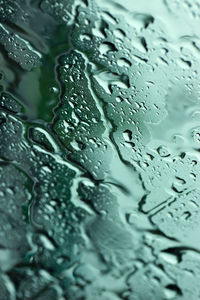 Full frame shot of raindrops on glass