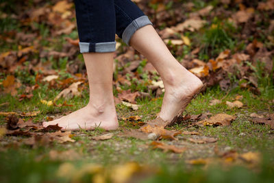 Low section of man standing on ground