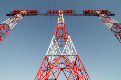 Low angle view of communications tower against sky