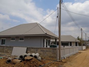 Low angle view of built structures against sky