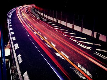 High angle view of light trails on road at night