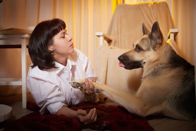 Portrait of young woman with dog