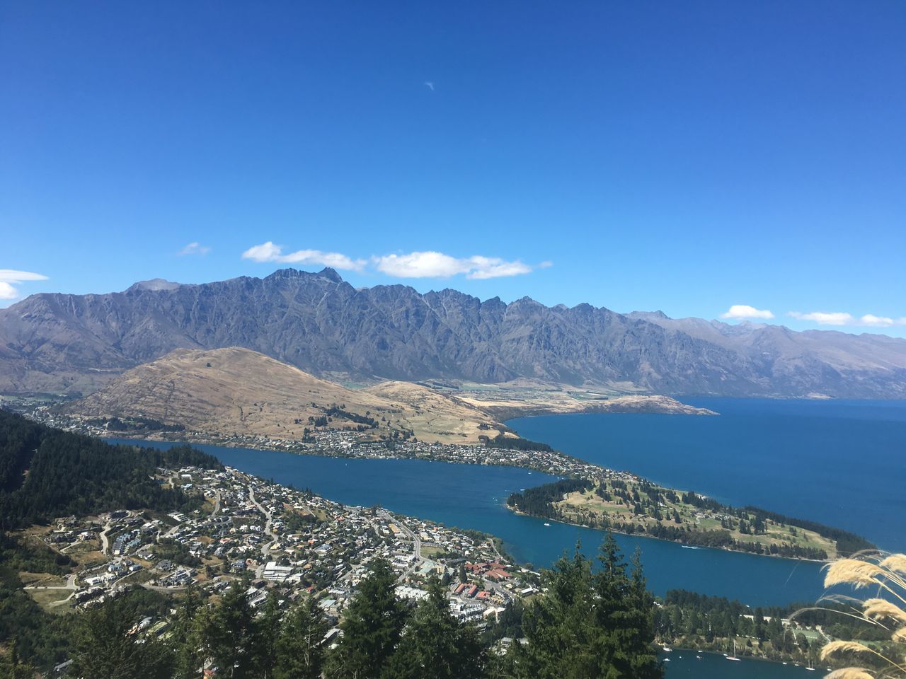 mountain, beauty in nature, scenics, nature, water, idyllic, blue, mountain range, no people, tranquility, sea, tranquil scene, outdoors, sky, architecture, day, tree, landscape