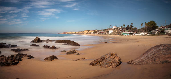 Scenic view of beach against sky