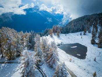 Scenic view of snow covered mountains against sky