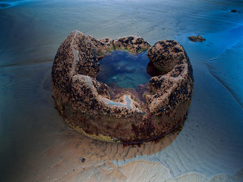 Broken boulder on beach