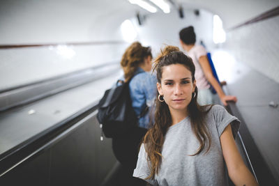 Portrait of woman on escalator