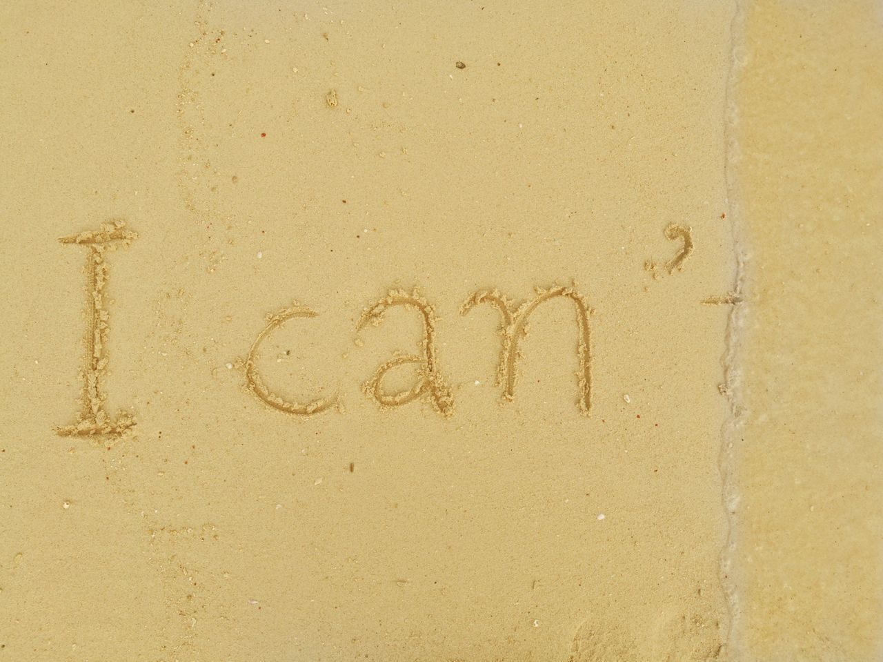 TEXT WRITTEN ON SAND AT BEACH