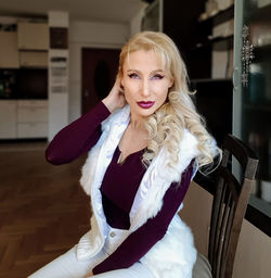 Portrait of woman standing at home