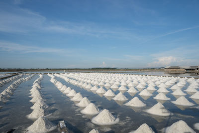 Scenic view of snow covered landscape against blue sky