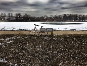 Scenic view of lake against sky during winter