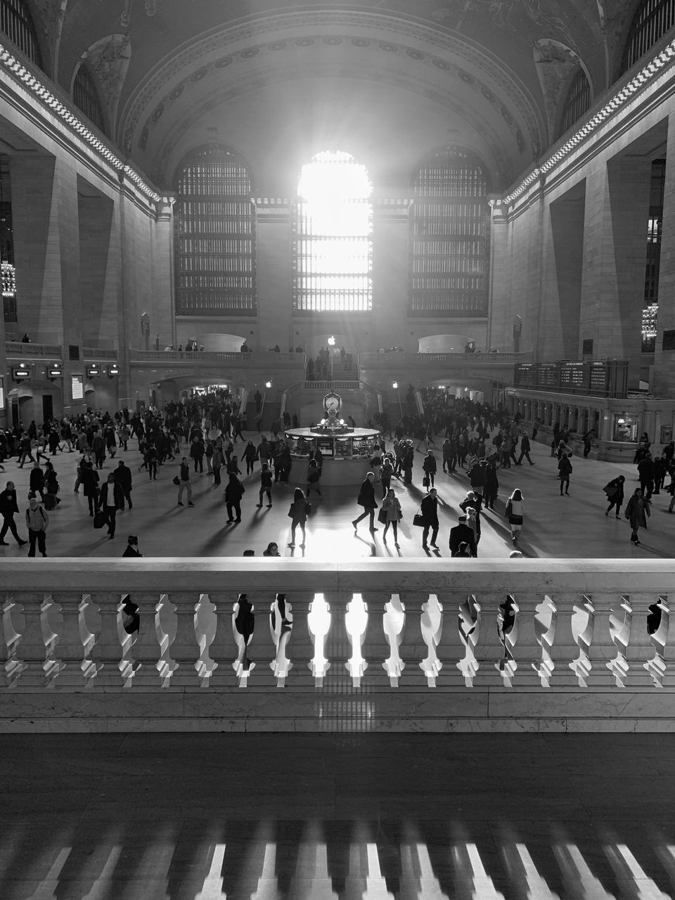 PEOPLE ON ILLUMINATED BUILDING IN CITY