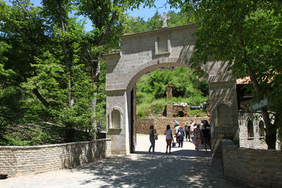 People walking in front of historical building