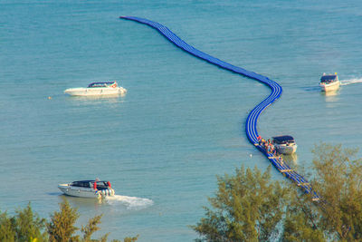 High angle view of people on sea against sky