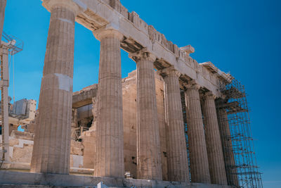 Low angle view of historical building against blue sky