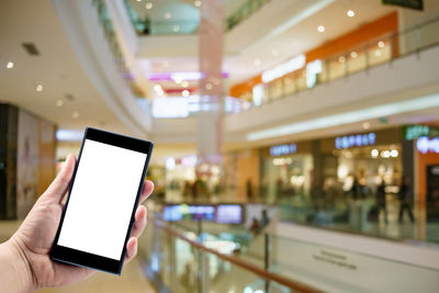 Close-up of hand using mobile phone