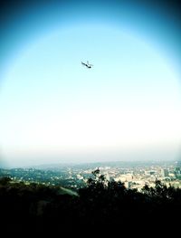 Aerial view of cityscape seen through airplane window