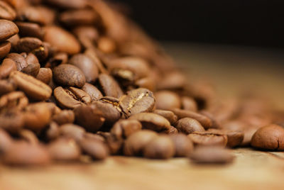 Close-up of coffee beans on table