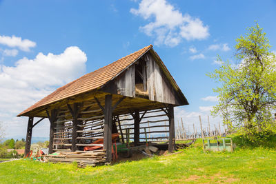 Built structure on field against sky