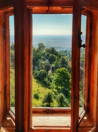 Scenic view of sea seen through window