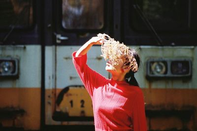 Rear view of woman with red umbrella