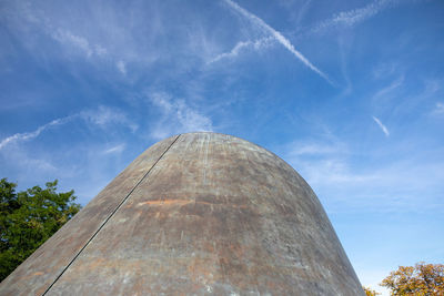 Low angle view of metallic structure against blue sky