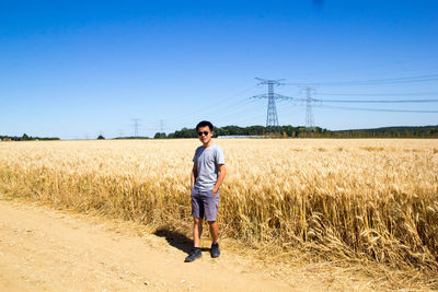 Full length of man standing on field