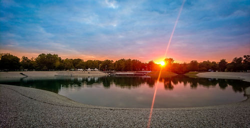 Scenic view of lake against sky during sunset